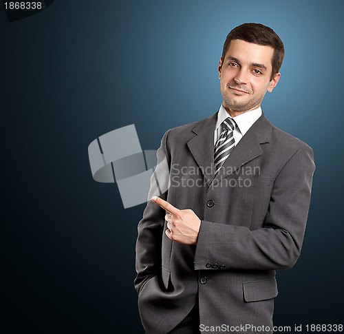 Image of Business Man Shows Something With Finger