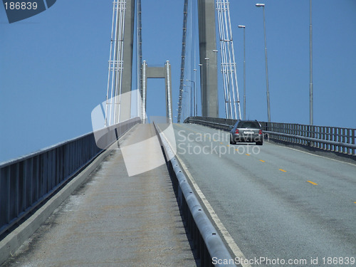 Image of Car driving over a big bridge