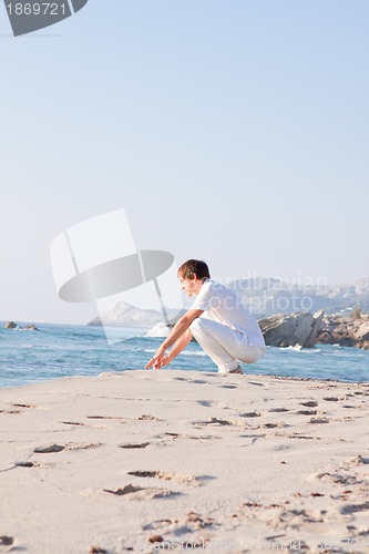 Image of young man is relaxing on beach in summer vacation