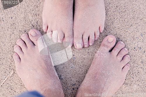 Image of barefoot in the sand in summer holidays relaxing