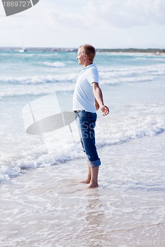 Image of young man is relaxing on beach in summer vacation