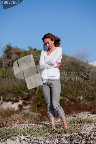 Image of beautiful woman relax in summer outdoor in wind dune beach