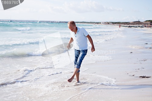Image of young man is relaxing on beach in summer vacation