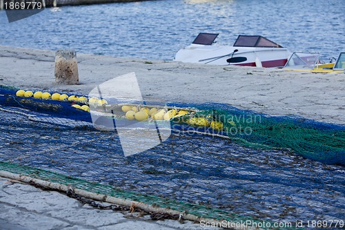 Image of fishnet trawl rope putdoor in summer at harbour