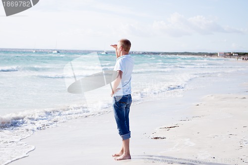 Image of young man is relaxing on beach in summer vacation