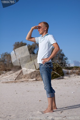 Image of young man is relaxing on beach in summer vacation