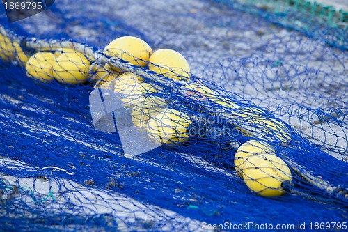 Image of fishnet trawl rope putdoor in summer at harbour