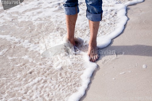 Image of barefoot in the sand in summer holidays relaxing