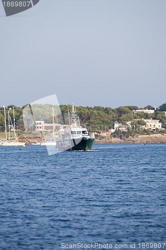 Image of fishing boat in summer outside in sea at harbour