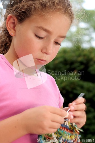 Image of Cute girl knitting