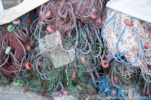 Image of fishnet trawl rope putdoor in summer at harbour