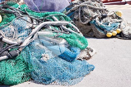 Image of fishnet trawl rope putdoor in summer at harbour