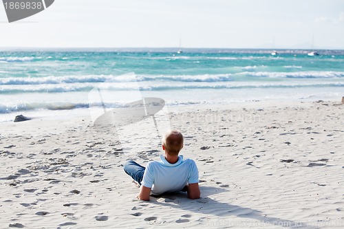 Image of young man is relaxing on beach in summer vacation