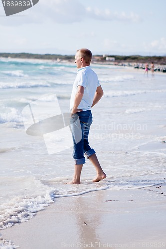 Image of young man is relaxing on beach in summer vacation