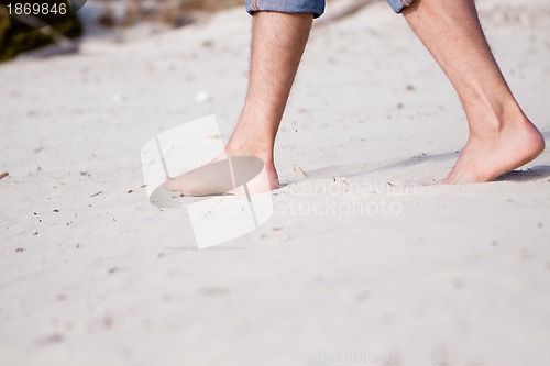 Image of barefoot in the sand in summer holidays relaxing