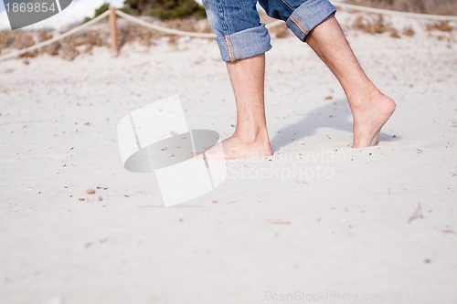 Image of barefoot in the sand in summer holidays relaxing