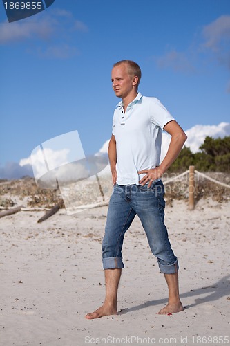 Image of young man is relaxing on beach in summer vacation