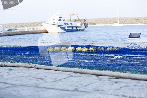 Image of fishnet trawl rope putdoor in summer at harbour