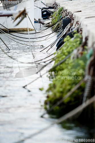 Image of fishing boat in summer outside in sea at harbour