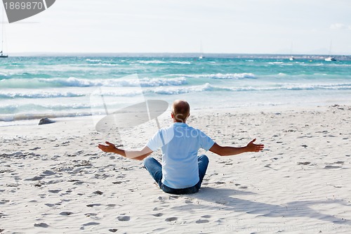 Image of young man is relaxing on beach in summer vacation