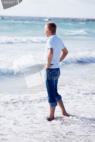 Image of young man is relaxing on beach in summer vacation