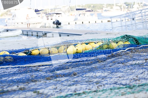 Image of fishnet trawl rope putdoor in summer at harbour