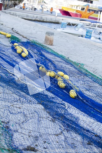 Image of fishnet trawl rope putdoor in summer at harbour