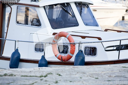 Image of fishing boat in summer outside in sea at harbour