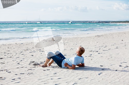 Image of young man is relaxing on beach in summer vacation