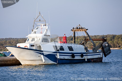 Image of fishing boat in summer outside in sea at harbour