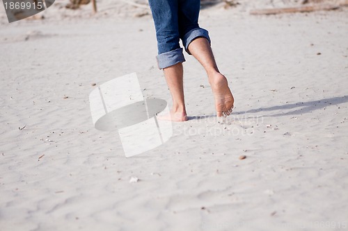 Image of barefoot in the sand in summer holidays relaxing