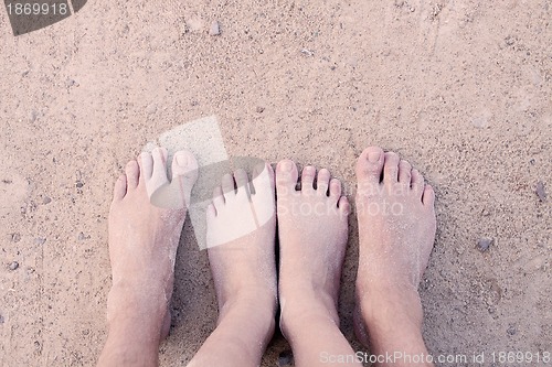 Image of barefoot in the sand in summer holidays relaxing