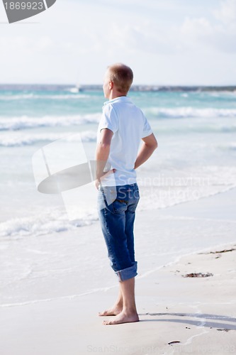 Image of young man is relaxing on beach in summer vacation