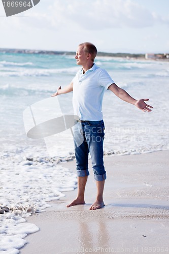 Image of young man is relaxing on beach in summer vacation