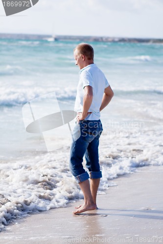 Image of young man is relaxing on beach in summer vacation