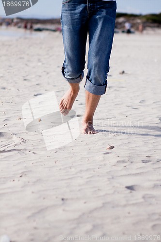 Image of barefoot in the sand in summer holidays relaxing