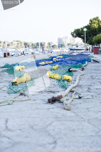 Image of fishnet trawl rope putdoor in summer at harbour