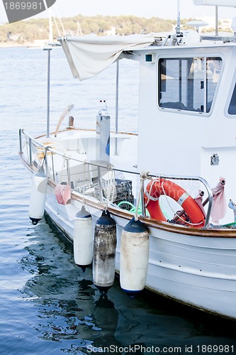 Image of fishing boat in summer outside in sea at harbour