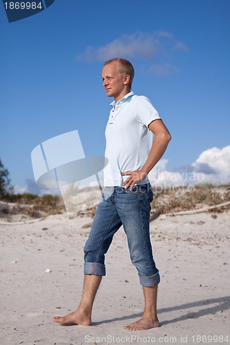 Image of young man is relaxing on beach in summer vacation