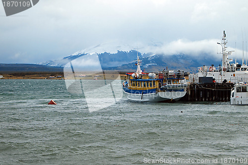 Image of Puerto Natales harbor with mountain in the background