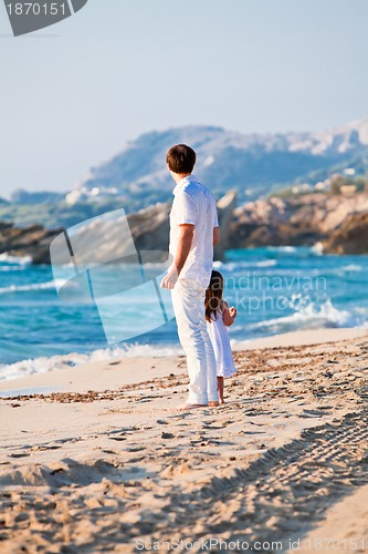 Image of happy family father and daughter on beach having fun