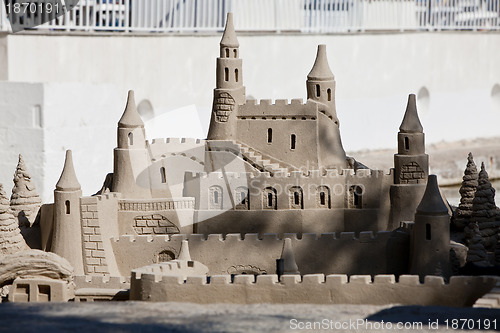 Image of creative big sandcastle on the beauch in summer