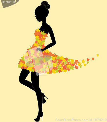 Image of Dancer girl in dress of autumn leaves
