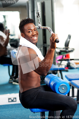 Image of Fit guy working out in gym
