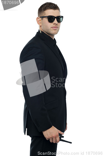 Image of Smart young confident security officer posing
