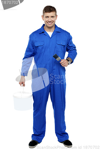 Image of Professional smiling painter. Full length portrait