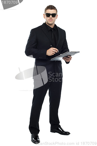 Image of Male bouncer holding clipboard