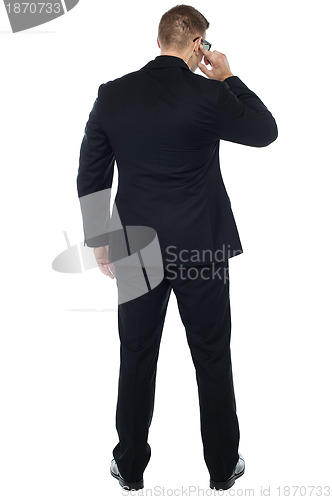 Image of Back pose of young male security person