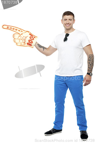 Image of Sports fan holding Boo Hurray foam hand