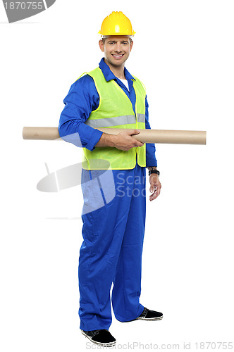 Image of Smiling young architect holding blueprints